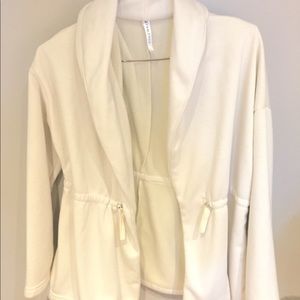 Cream Fabletics sweater.